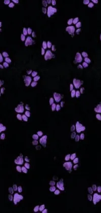 This live wallpaper features purple paw prints on a black background, arranged in a fun 3-4-5-3-1 pattern