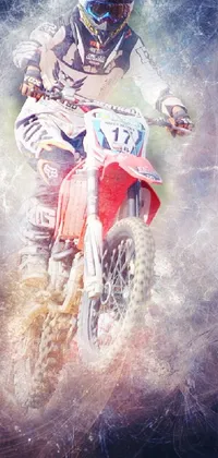This phone live wallpaper portrays a dirt bike rider performing a daring stunt over rocky terrain