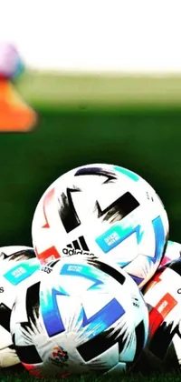 Get ready to score a stunning live wallpaper for your phone! The Soccer Balls on Field design features a pile of soccer balls against a lush green background