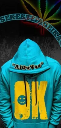 Looking for a cool and funky phone live wallpaper? Check out this close-up of a person wearing a hooded sweatshirt with a graffiti-inspired design