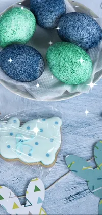 This phone live wallpaper captures a cozy kitchen scene with a bowl of blue and green cookies as its centerpiece