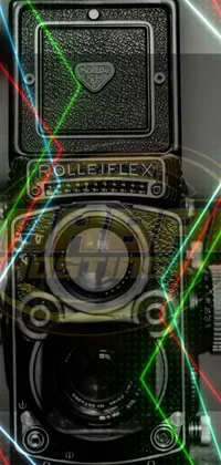 This phone live wallpaper showcases a vintage Rolleiflex TLR camera placed on a table and presented in HDR refractions for a stunning effect