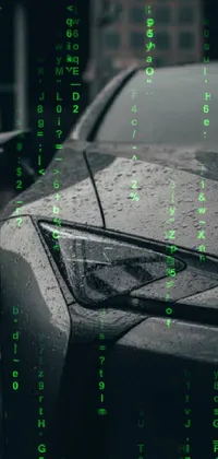 This phone live wallpaper showcases a stylish gunmetal grey car in the rain