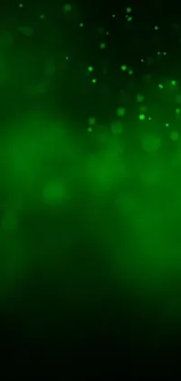 This lively phone live wallpaper features a mesmerizing close up of a green background with deviantart and houdini particles
