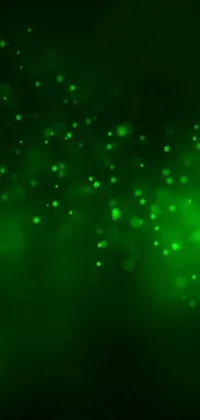 This phone wallpaper boasts a striking green light shining boldly against a black backdrop