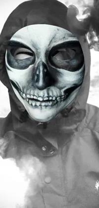 This live wallpaper features a black and white digital art image of a person wearing a skeleton mask and dark hood, set against a dark background