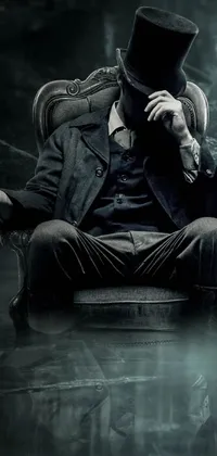 This is an intriguing and mysterious live wallpaper for your phone that features a man in a top hat sitting in a chair against a black-water background