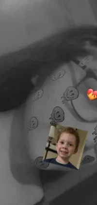 This live wallpaper showcase features a captivating black and white photo of a child with a unique heart-shaped face