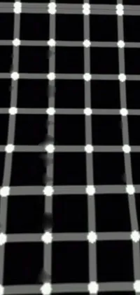 Looking for a stylish and unique live wallpaper for your phone? Check out this black and white plaid design with white dots, a vintage photo, optical illusion, solid object, and small black eyes scattered across the screen