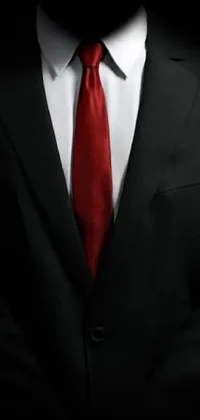 This live wallpaper features a minimalist design with a figure in a suit and red tie, perfect for anyone who wants to add a touch of intrigue to their phone screen