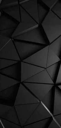 Bring a sleek and stylish look to your Android device with our black triangle live wallpaper! This Tumblr-inspired wallpaper features a series of black triangles on a black matte background, creating a bold and geometric display that is sure to impress