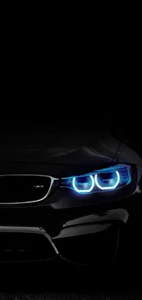 Get mesmerized by this stunning live wallpaper featuring the image of a hyper-realistic BMW car in the dark