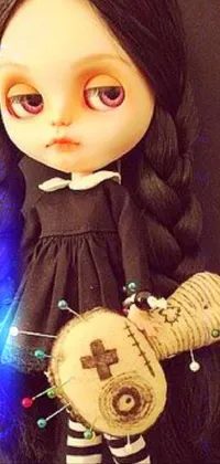 This phone live wallpaper showcases a hauntingly beautiful doll holding a piece of wood against a dark backdrop
