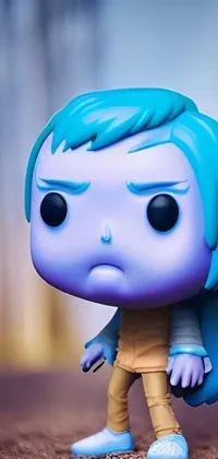 Experience a captivating live wallpaper for your phone that showcases a close-up of a blue-haired figurine with a cute expression and exaggerated features in the popular Funko Pop! style