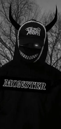 This black and white live wallpaper showcases a provocative photograph of a person wearing a monster mask for an edgy and mysterious effect