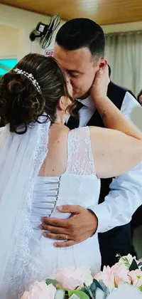 This live wallpaper features a beautiful image of a bride and groom kissing at their wedding reception