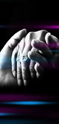 This captivating phone live wallpaper features a detailed digital rendering of two hands holding each other