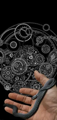 This phone live wallpaper features a black and white drawing of a detailed and intricate clock, with hyper-detailed and mesmerizing clockwork gears and cogs