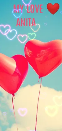 This charming phone live wallpaper showcases two red heart shaped balloons floating in the sky and offers a retro feel that channels the artistic style of times gone by