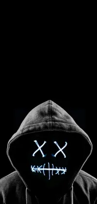 This live wallpaper depicts a person wearing a black hoodie and a neon mask with a smiley face