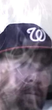 This live wallpaper depicts a close-up of someone wearing a stylish hat, set against a backdrop of swirling exhaust smoke