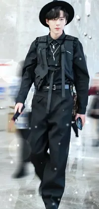 This live phone wallpaper showcases a striking individual dressed in black military attire, holding an MP7 gun
