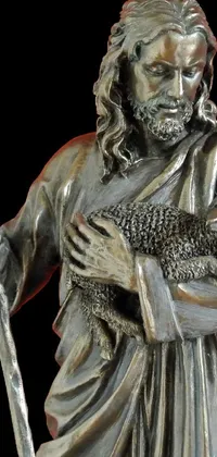 This live phone wallpaper displays a captivating bronze sculpture of a man holding a sheep