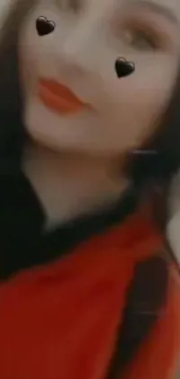 This stunning phone live wallpaper features a person wearing a red shirt with bright red lips, offering an alluringly close-up view