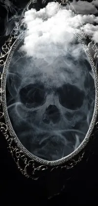 Add a touch of darkness to your phone with this skull-themed live wallpaper! The intricate filigree frame encases the eerie skull, which appears to emit wisps of smoke that delicately swirl around the design
