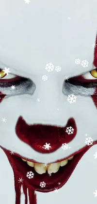 Looking for a creepy new wallpaper for your smartphone? Check out this dread-inducing live wallpaper! The design features a portrait of a sinister clown, reminiscent of the infamous Pennywise