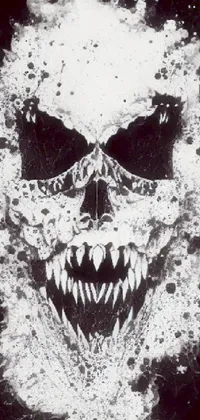 This striking phone live wallpaper is a black and white image of a skull with sharp teeth surrounded by splattered tar and wrapped in a venom symbiote
