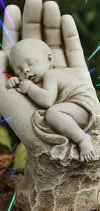 This live wallpaper features an adorable illustration of a hand holding a sleeping baby