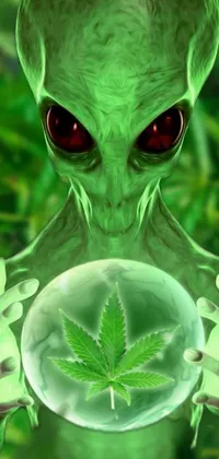 This live wallpaper features digital art of a green alien holding a glass ball with a marijuana leaf in it