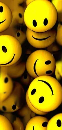 This live wallpaper for phones features a bunch of cute yellow smiley faces with various expressions like a wide grin, a toothy smile, a winking expression, amongst others
