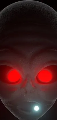 Looking for an otherworldly web experience? Check out this live wallpaper featuring a close-up of an alien head with red eyes