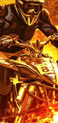 This phone live wallpaper features a powerful image of a dirt bike with flames overlay on gold and black metal