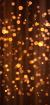 This phone live wallpaper showcases a stunning digital artwork of blurry lights against a black background, with warm brown and gold tones creating an elegant color scheme
