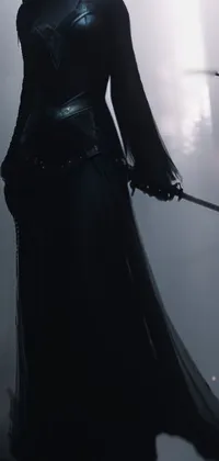 This mesmerizing live wallpaper features a woman holding a scythe in a long black dress in a foggy, enchanting atmosphere