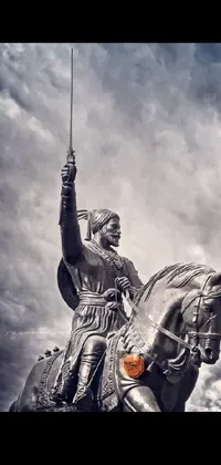 This breathtaking phone live wallpaper features a stunning statue of a warrior riding on the back of a mighty horse, capturing a triumphant moment in battle