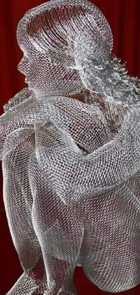 This live wallpaper features a dazzling wire sculpture made of shiny white metal sitting atop a table