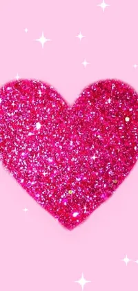 This live phone wallpaper features a beautiful pink glitter heart set against a soft pink background