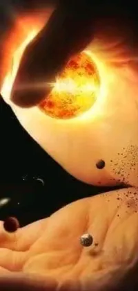 This space-themed live wallpaper depicts a person holding a small object against a backdrop of stunning images of the sun exploding