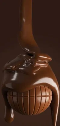 This phone live wallpaper showcases a photorealistic 3D sculpture of a chocolate bar with a spoon