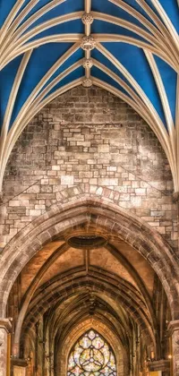 This stunning live wallpaper for phones features a Romanesque cathedral with a beautiful stained glass window