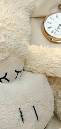 Looking for a cozy phone wallpaper that provides both style and functionality? This live wallpaper features a cuddly stuffed animal, with big round eyes closed in contentment