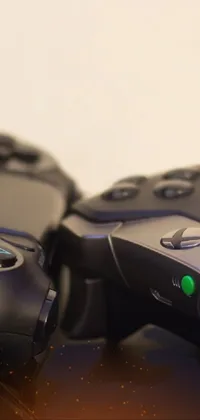 This live wallpaper features two video game controllers - one Xbox and one PlayStation 4, placed side by side with all their buttons visible in a close-up shot
