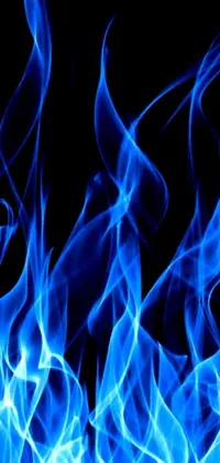 This live phone wallpaper depicts a mesmerizing blue fire with white smoke gracefully emanating from its sides
