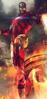 This mobile live wallpaper depicts a superhero in motion, dressed in metallic armor and soaring through the air in flames