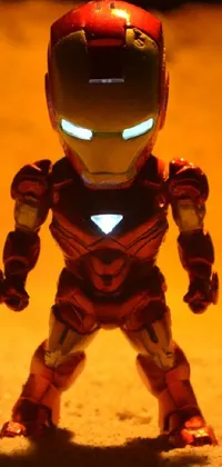 Featuring a chibi-style toy Iron Man standing confidently next to a large rock, this phone live wallpaper is sure to delight Marvel fans