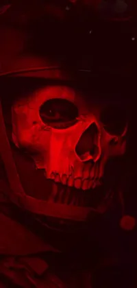 Get hyped with this exciting phone live wallpaper! Featuring a detailed skull wearing a metallic helmet with intricate designs, this digital art is perfect for those who love cyberpunk themes